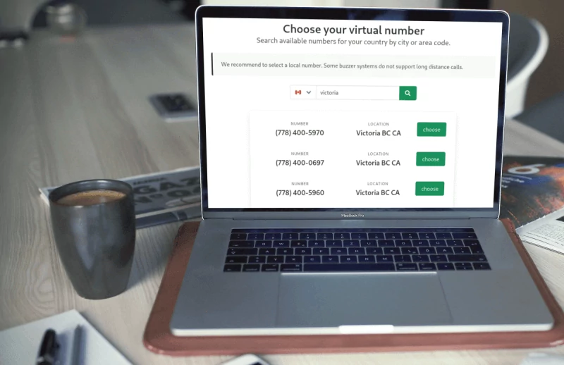 laptop on a table showing a screenshot of the FreshBuzzer product